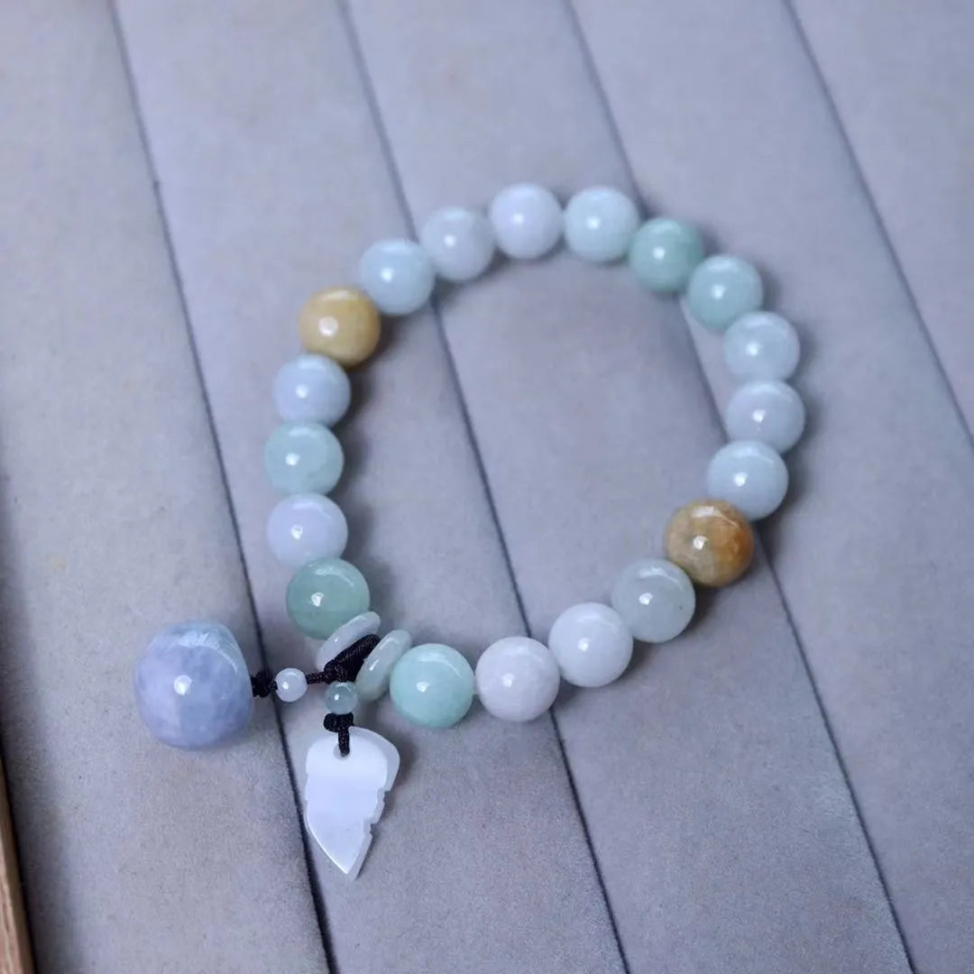 Green jade bracelet with geometric hanging beads and Maitreya Buddha charm