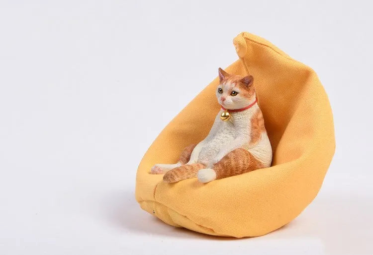 Small 7.5cm lazy cat ornament with sofa on car dashboard
