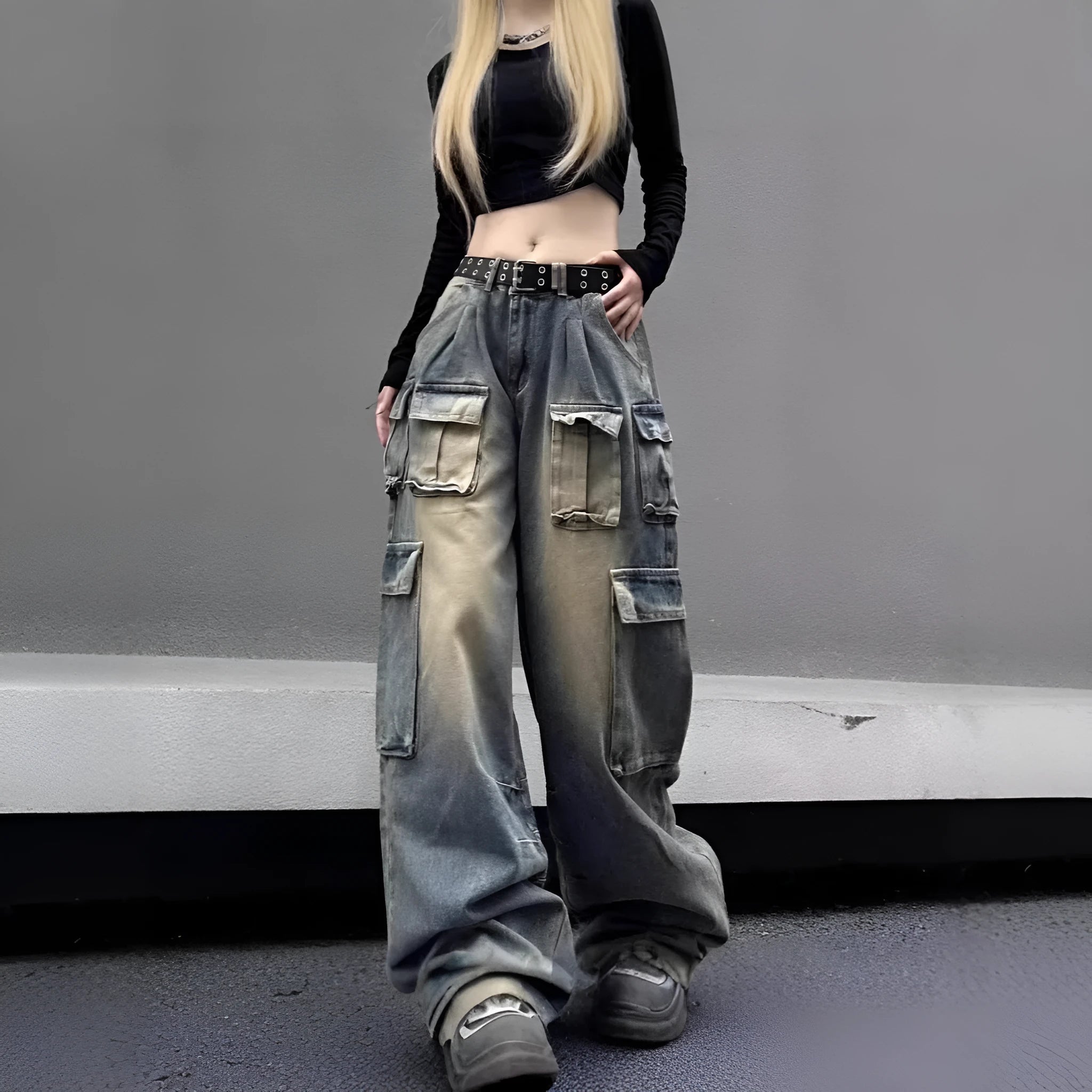 Loose-fit distressed denim jeans with multiple pockets in light blue wash, straight-leg street hipster style