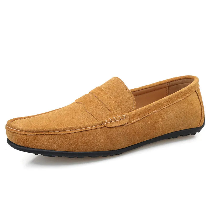 Men's solid colour suede loafers with round toe and rubber sole on a neutral background.
