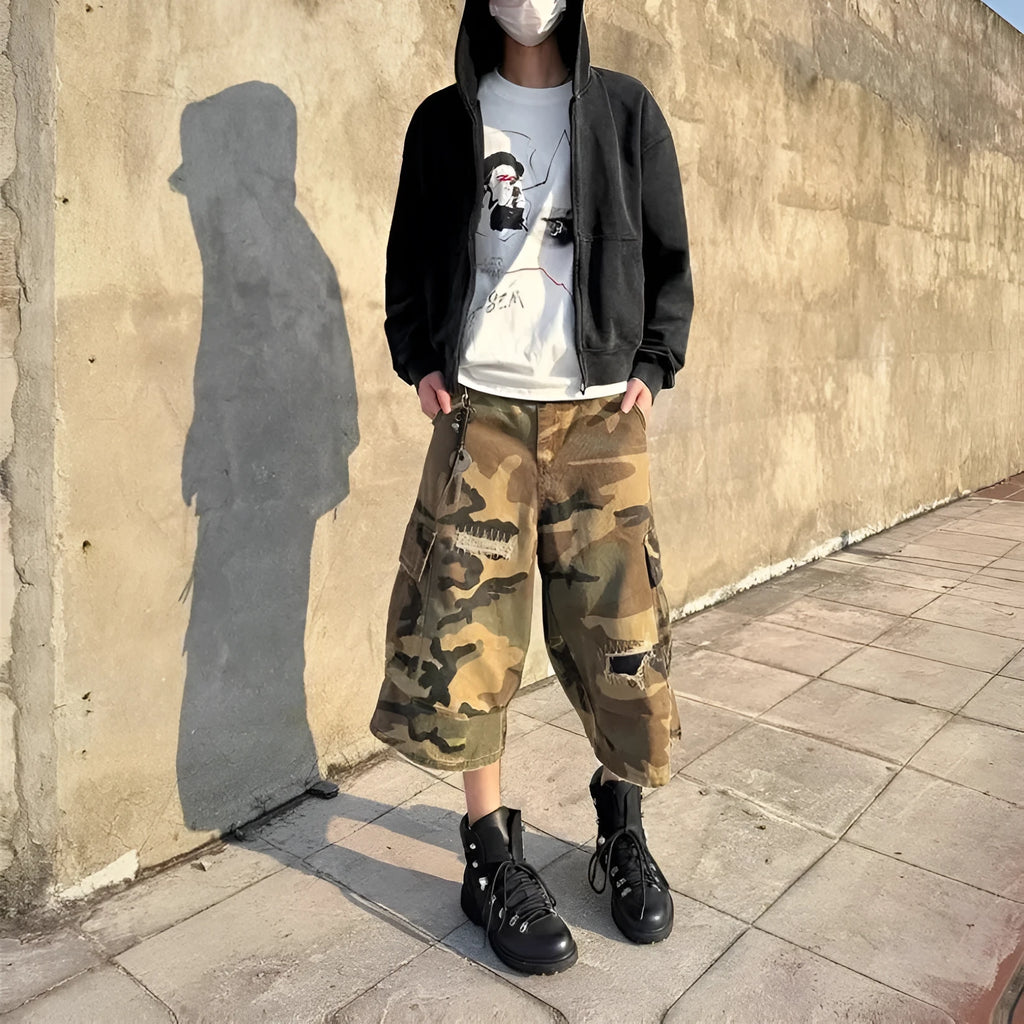 Men's camouflage cropped jeans with distressed patch detailing and straight-leg styling