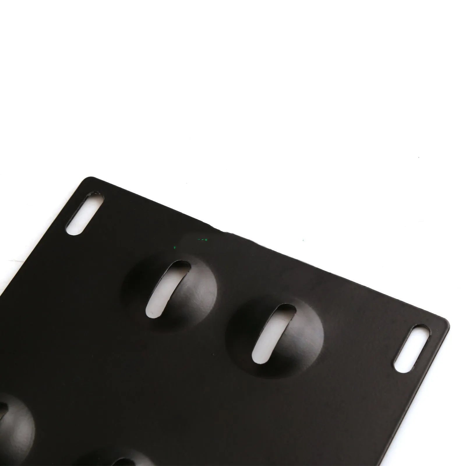 Metal American licence plate frame with integrated trailer hook for car modification on a vehicle