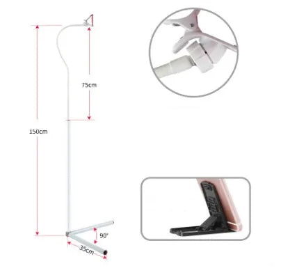 Black mobile phone bed bracket mounted bedside with adjustable overhead support shelf holding smartphone
