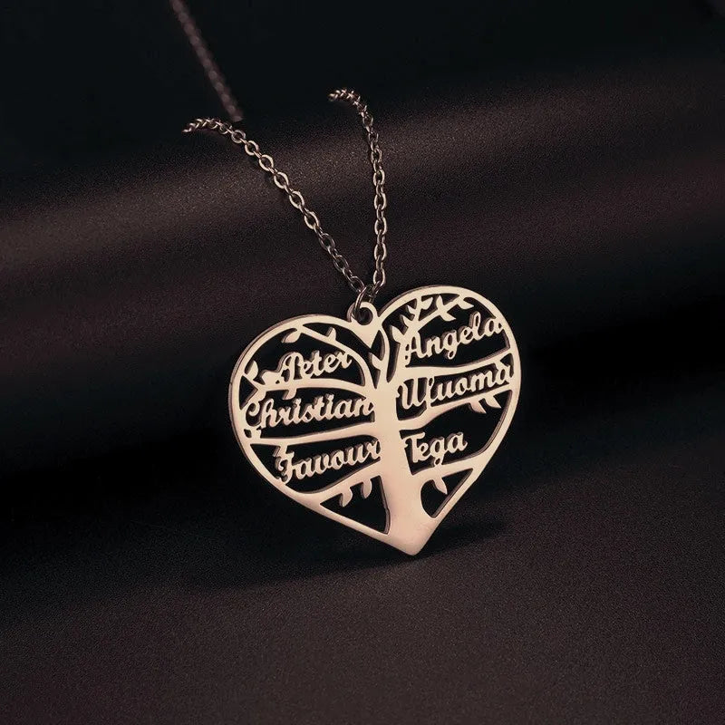 Custom stainless steel name necklace with hollow heart pendant showing engraved names in a family tree design.