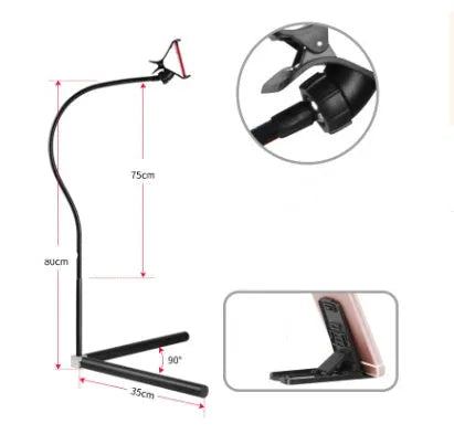 Black mobile phone bed bracket mounted bedside with adjustable overhead support shelf holding smartphone