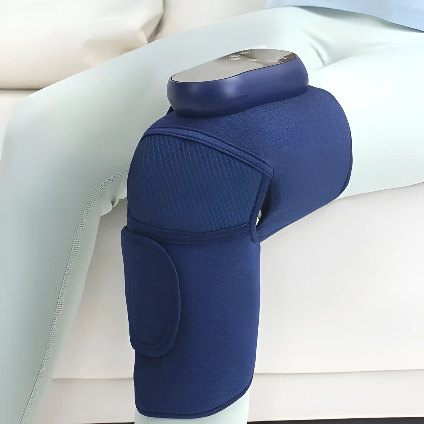 Airbag Blue self-heating knee massager showing adjustable straps for free-size fit
