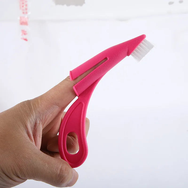 Red and white finger toothbrush for pet dental cleaning with soft silicone bristles