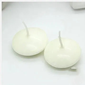 Ivory white cylindrical floating candles made of paraffin wax in a 10 pack for wedding decor