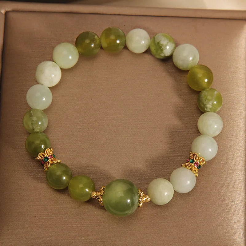 Women's green Xiuyan jade bracelet with an original sweet Mori style design.