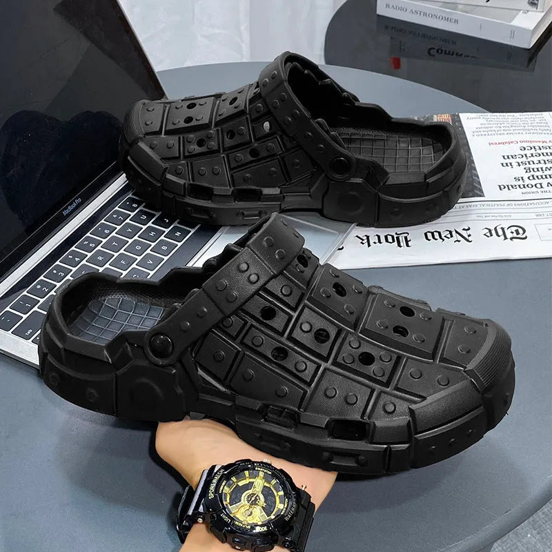 Men's black EVA slippers with thick sole, non-slip tread, and toe separator design on a white background.