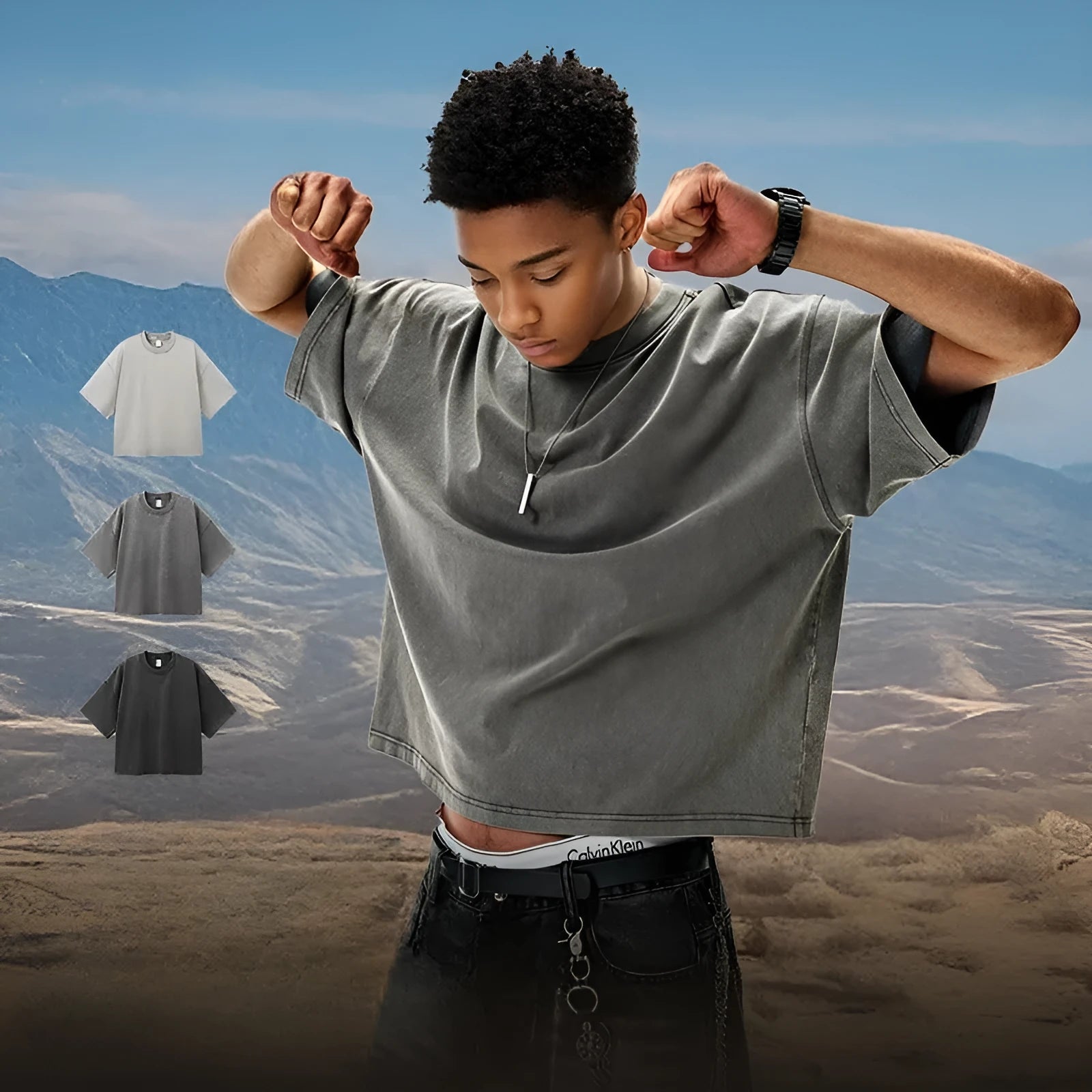 Men's vintage-style light khaki cotton t-shirt with a loose fit and drop-shoulder sleeves on a hanger.