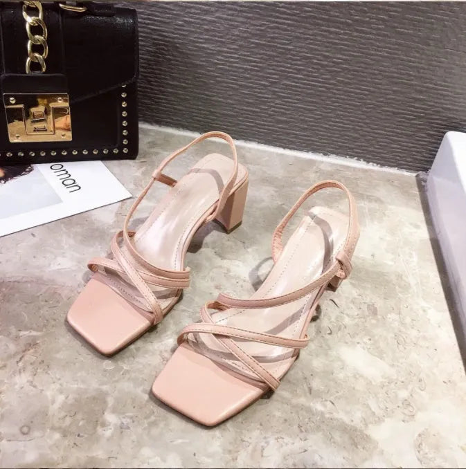 Women's white thick heel Roman sandals with a super high heel and sleeve style fit.