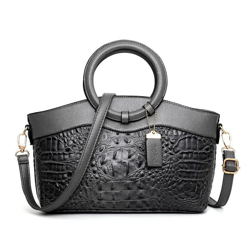 Fabric ladies casual handbag showing multiple compartments including zipper pocket and phone bag