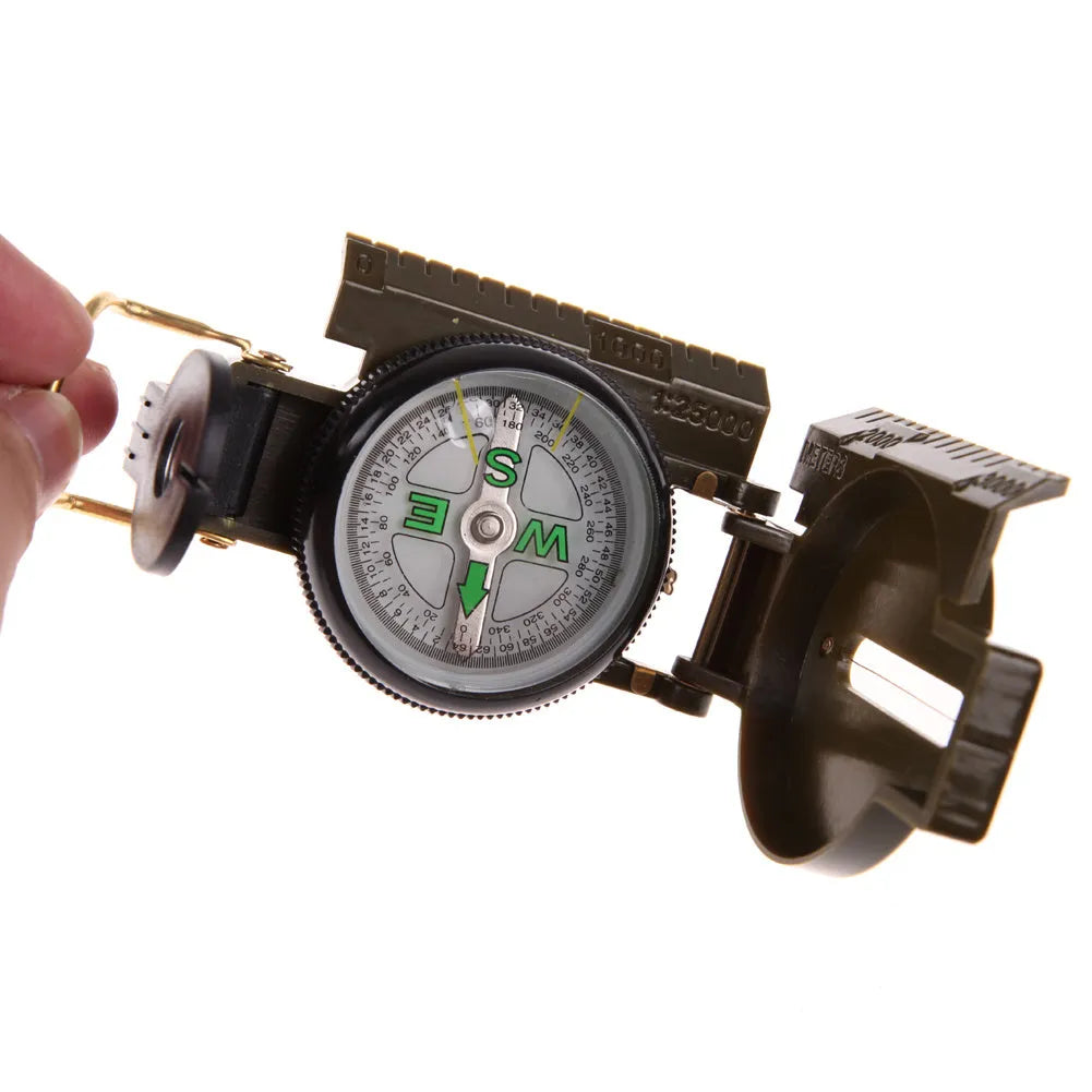 Army Green aluminium alloy compass with kerosene-damped movement open on neutral background