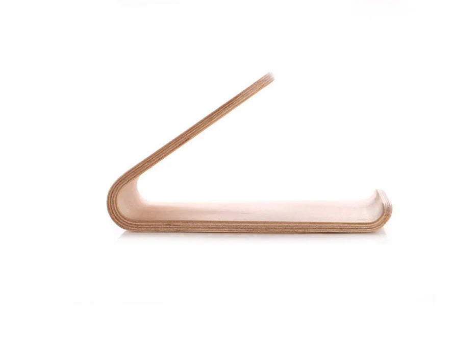 Solid wood iPhone stand in walnut finish on a desk