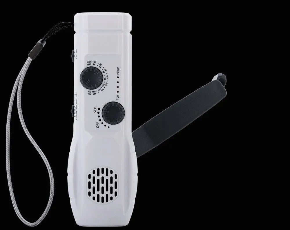 Hand-cranked emergency radio flashlight with USB charging port built-in speaker and manual tuning dial in black