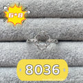Open-mouth oval denier ring with a 6x8mm stone and five-pointed star decoration on a copper band.