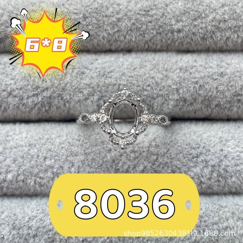 Open-mouth oval denier ring with a 6x8mm stone and five-pointed star decoration on a copper band.