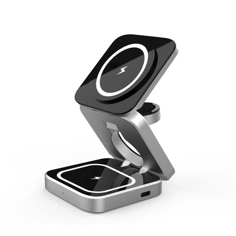Folding three-in-one desktop wireless charging bracket for Apple, Samsung, and Google Pixel devices on a table.