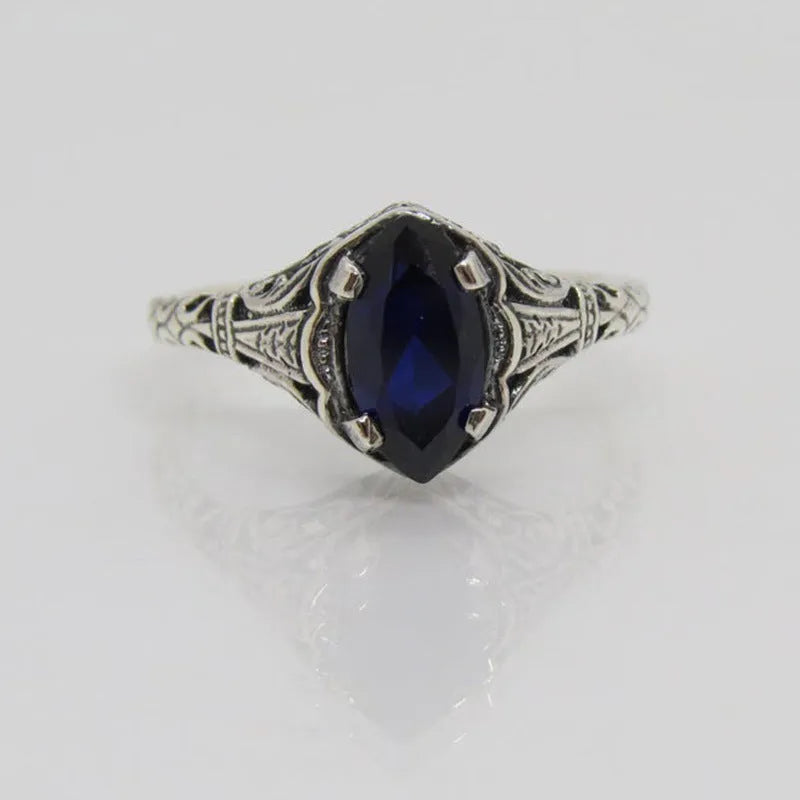Women's geometric hollow ring in silver electroplated alloy showing openwork pattern