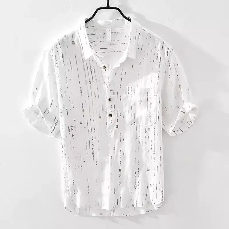 A man's loose-fit short-sleeved polo shirt in black, showing the lapel collar and casual cardigan style.