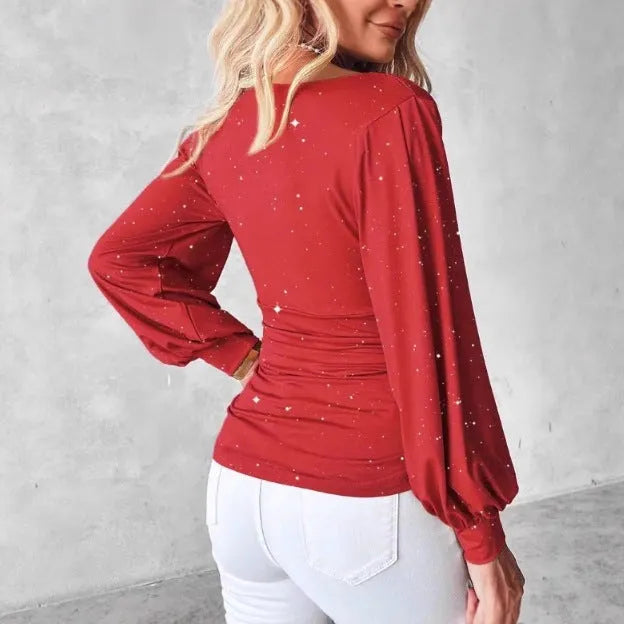 Women's red polyester draped neck top with flared long sleeves and sequin detail on a hanger