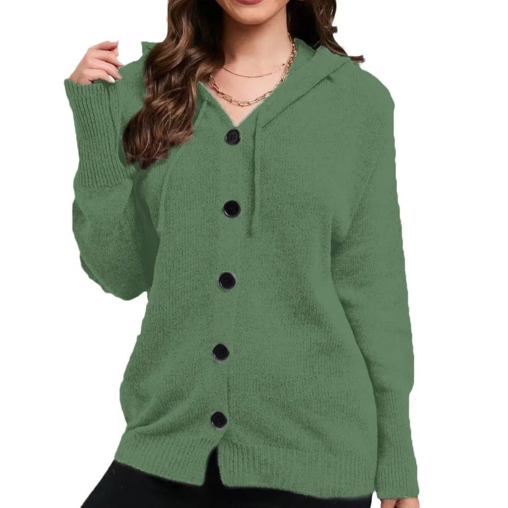 Woman wearing a loose fit, hooded, caramel-coloured cotton cardigan sweater with a textured pattern.