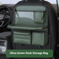 Car seat lazyback storage bag in Obsidian Black with foldable dining table extended, hanging on a car front seat backrest