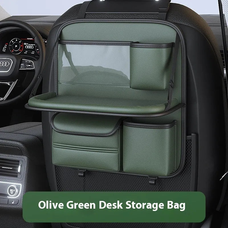 Car seat lazyback storage bag in Obsidian Black with foldable dining table extended, hanging on a car front seat backrest