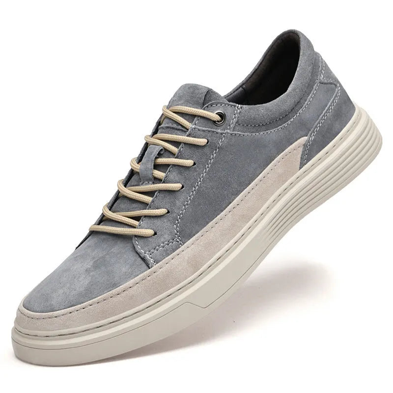 Men's grey casual leather skate shoes with round toe, low top design and rubber soles