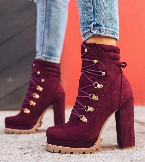Women's suede ankle boots with a thick high heel in army green, shown from the side.