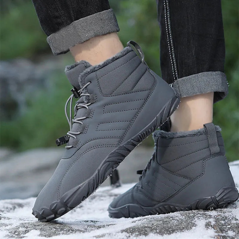 Outdoor winter slip-on boots for men and women with non-slip rubber sole, artificial plush lining, and waterproof Oxford cloth upper in black colour