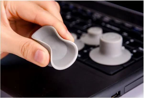 Grey laptop cooling pad set with large and small durable plastic pads for notebook temperature reduction