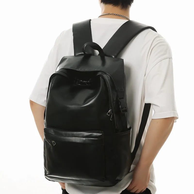 Travel Out large capacity PU leather backpack in black with air pillow belt and sewing thread design, 33x16x46cm