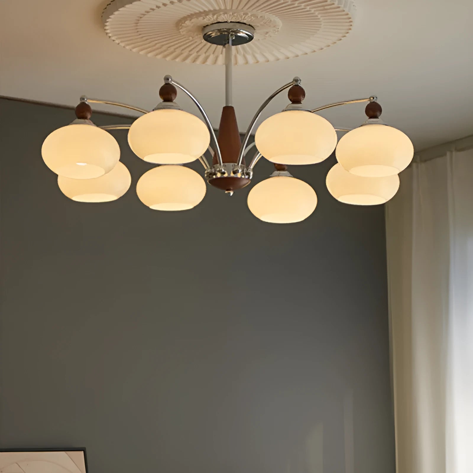 Creative persimmon glass chandelier with chrome frame and multiple glass shades in milky white or cream yellow.
