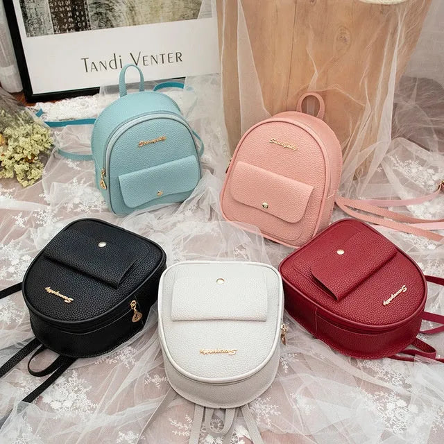Women's small black PU backpack purse with letter design and zipper closure