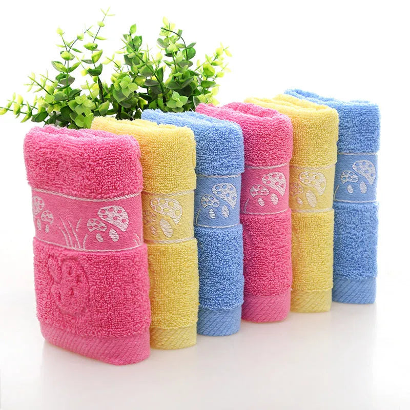 Cotton face towel 73x33cm in blue pink yellow patterns on hanger