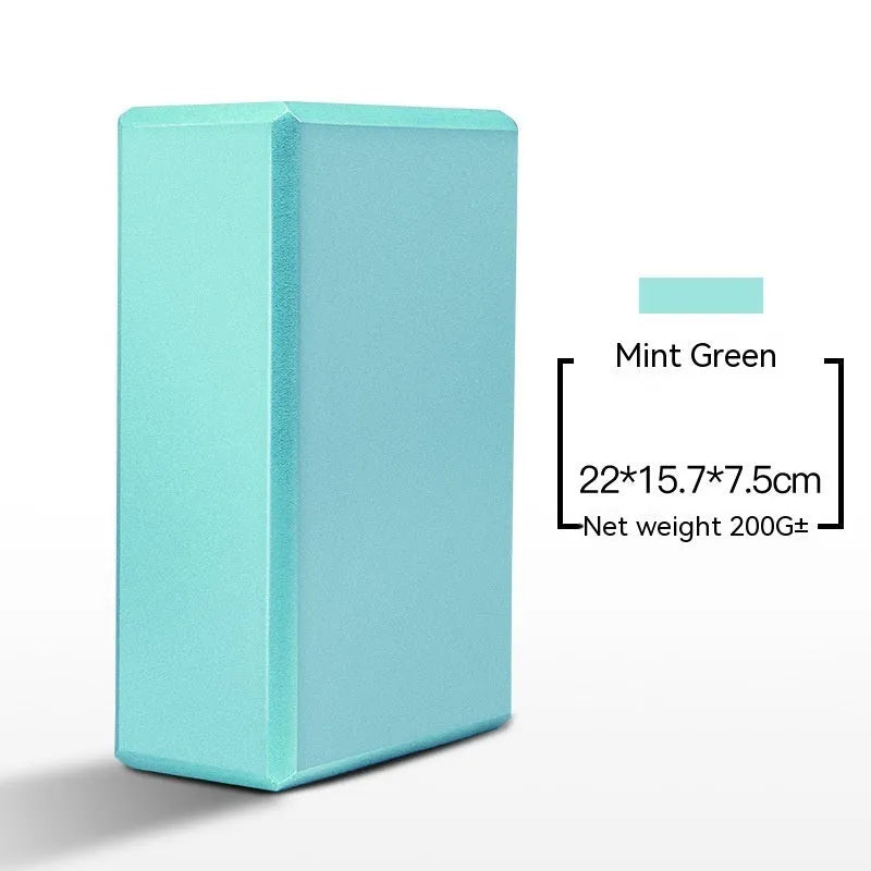High-density EVA foam yoga block in various colours and prints on a workout mat.