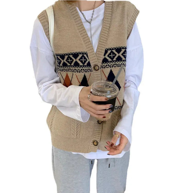 Khaki diamond plaid sleeveless cardigan top laid flat, showing loose fit and sleeveless armholes.