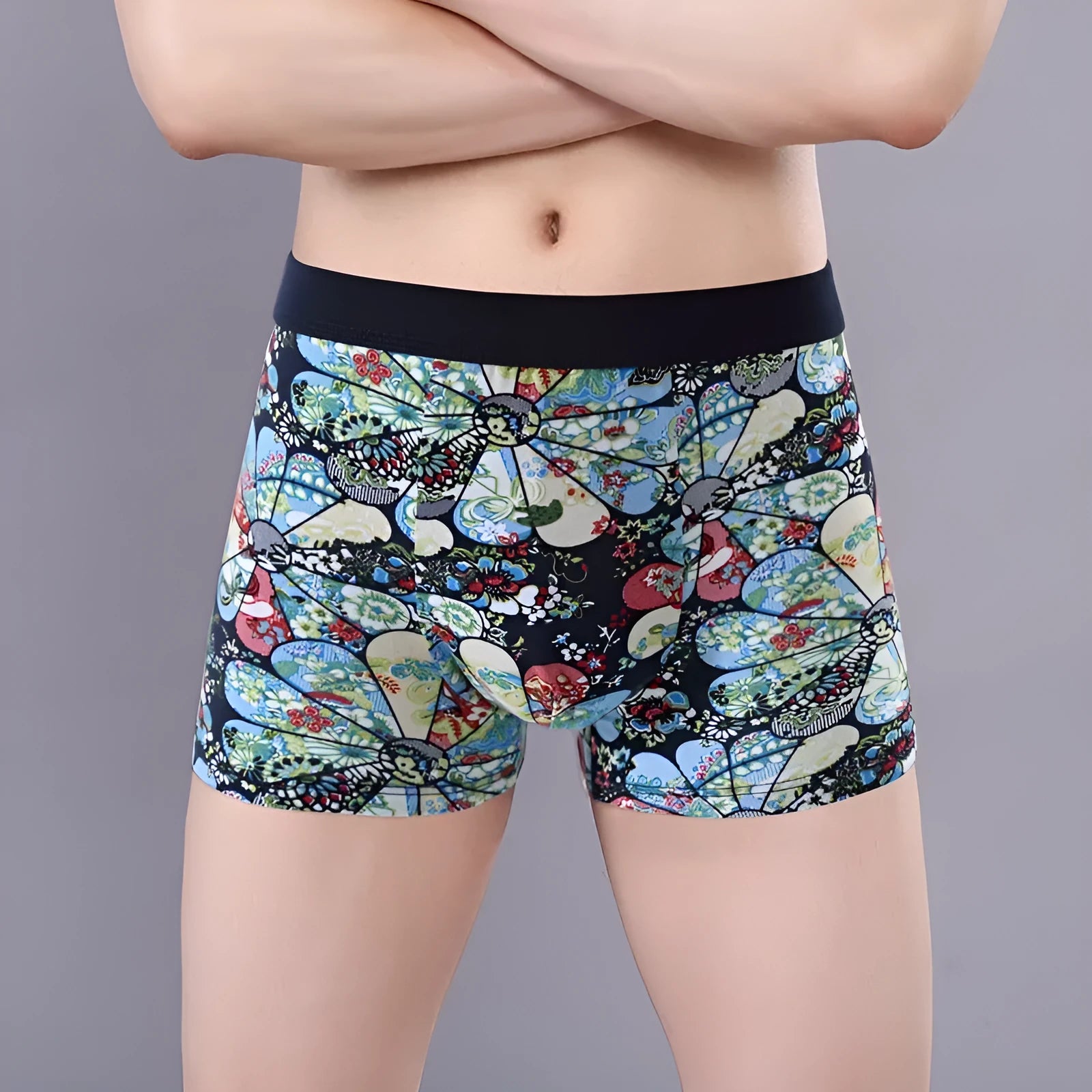 Men's floral print cotton boxer shorts showing mid-waist fit and U-shaped convex design.