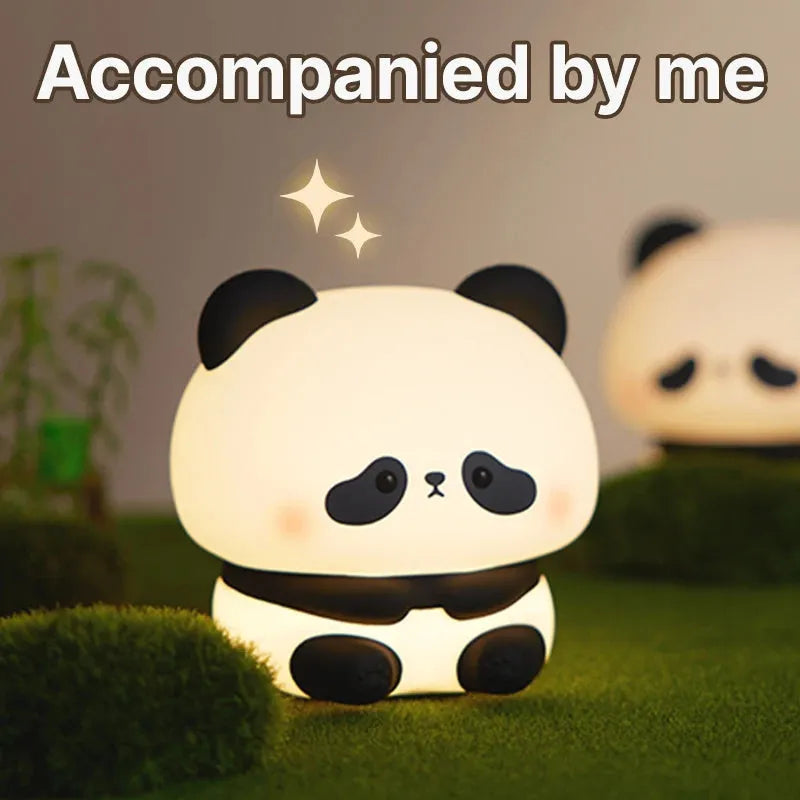 Panda LED night light with soft silicone head, USB rechargeable, touch control, colourful lights, on a bedside table