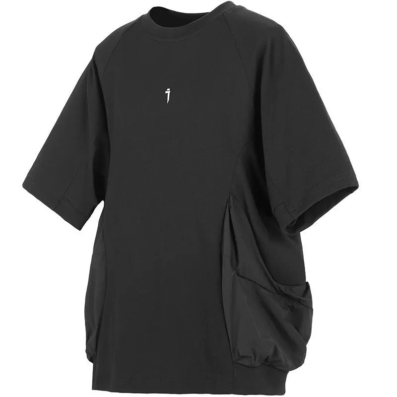 Men's loose grey cotton t-shirt with large chest pockets and short sleeves on a mannequin.