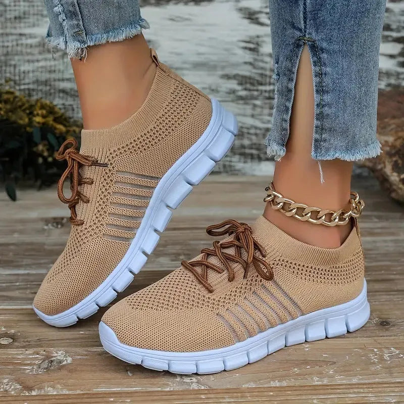 Women's casual breathable flying knit flat shoes in various colours on a white background.