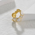 Adjustable geometric ring in stainless steel with electroplated finish, showing open design for flexible sizing