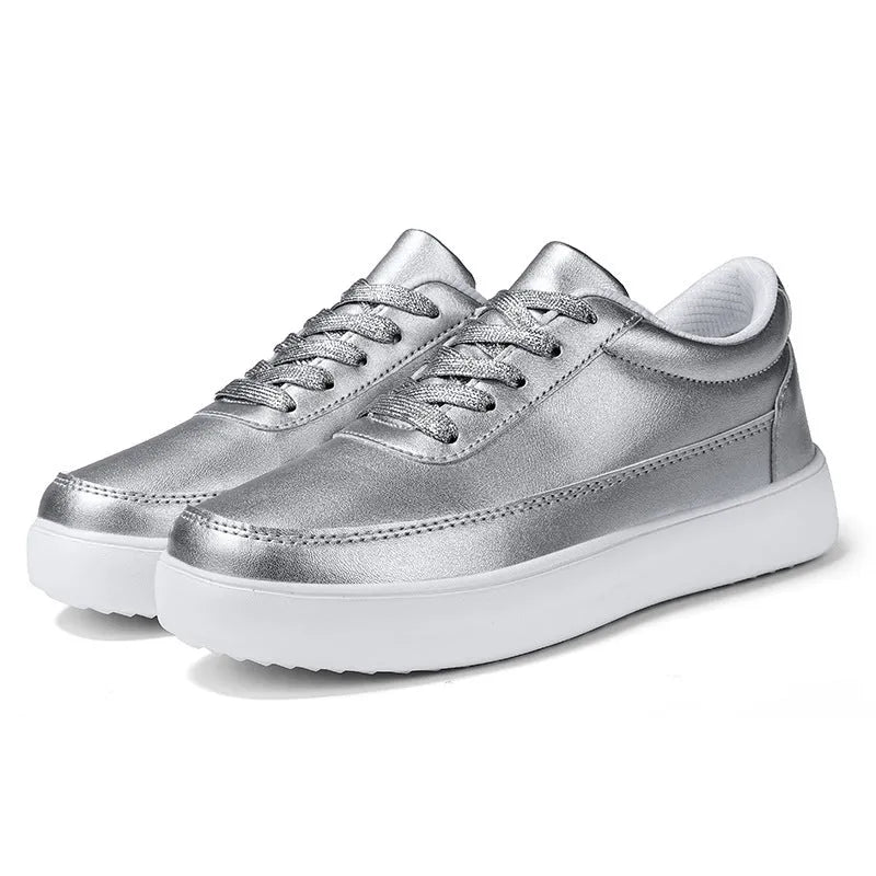 Women's white leather lace-up casual flat shoes on a solid background.