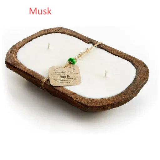 Lavender-coloured wooden basin containing a soy wax aromatherapy candle with three wicks.