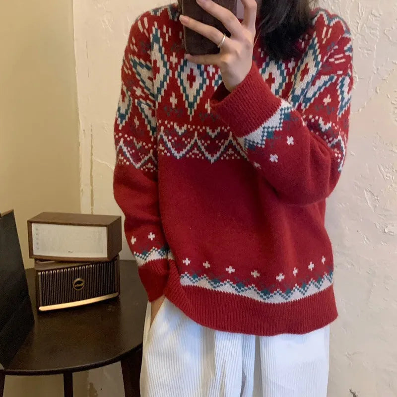 Red and white striped loose retro-style long sleeve pullover knitted top on a hanger.