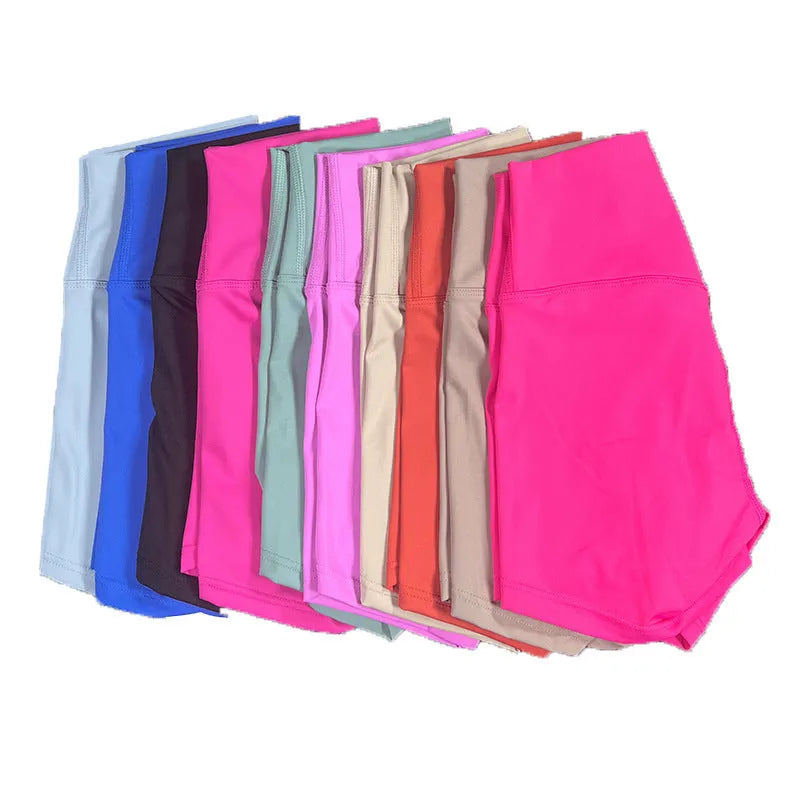 Women's high waist yoga shorts in nylon fabric, shown in pink litchi colour.