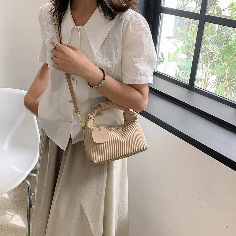 Women's PU leather pleated cloud crossbody bag in black front view