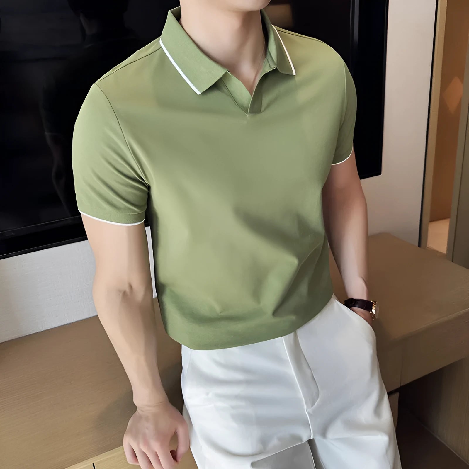Mens solid colour lapel polo shirt in a cotton blend fabric on a hanger